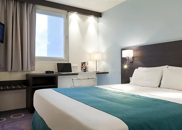 Kyriad Gare - Grand Palais Hotel